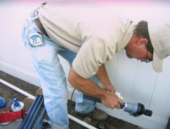 Installing a new valve during a sprinkler repair in Fort Lauderdale, FL